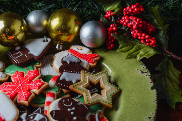 Close up of plate with colorful christmas cookies  - Zdjęcie, obraz