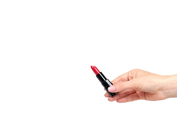 Hand with red lipstick in black tube, beauty and care. - Foto, Imagem