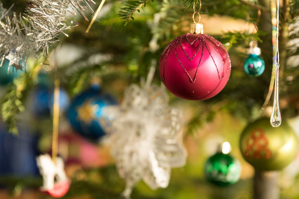 Christmas tree with christmas baubles - closeup - Zdjęcie, obraz