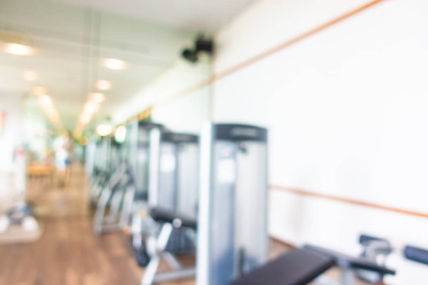 Abstract blur and defocus fitness equipment in gym room interior - Фото, изображение