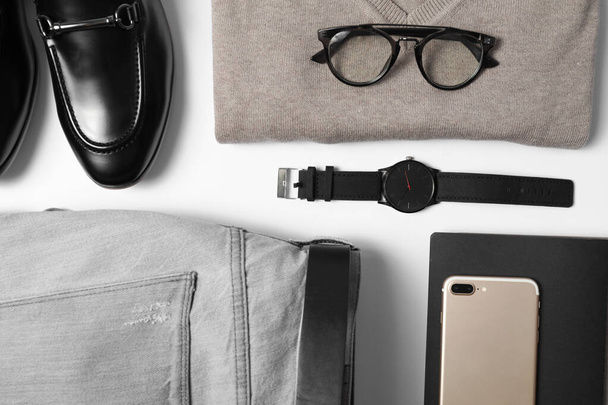 Stylish male autumn outfit and accessories on white background, flat lay. Trendy warm clothes - Valokuva, kuva
