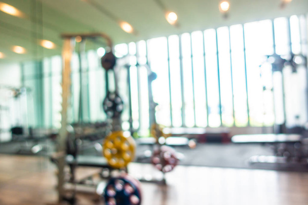 Abstract blur and defocus fitness equipment in gym room interior - Photo, Image
