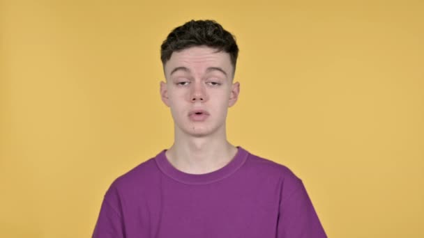 Yes, Young Man Shaking Head to Accept on Yellow Background - Video