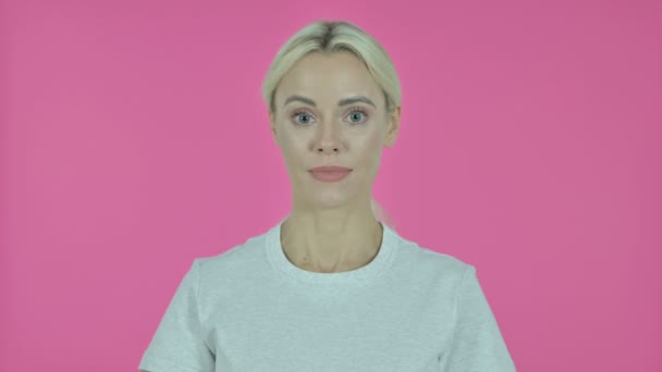 Online Video Chat by Young Woman on Pink Background - Πλάνα, βίντεο
