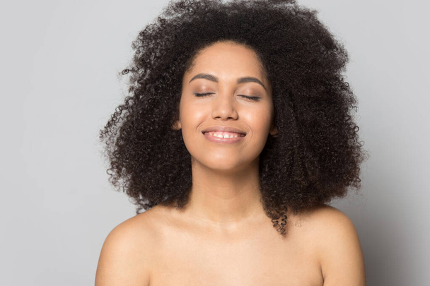 Happy african American girl pleased with healthy skin - Foto, Imagem