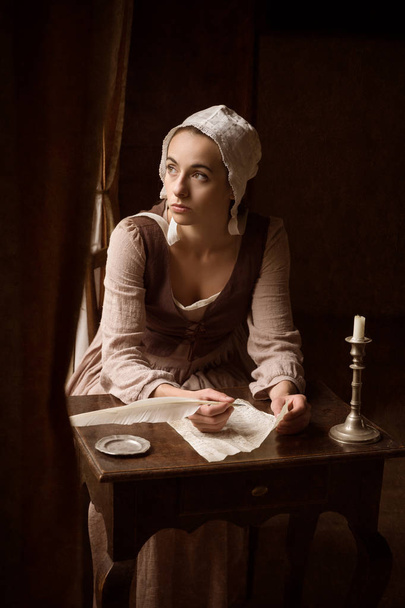 Vermeer style woman with letter - Foto, Imagem