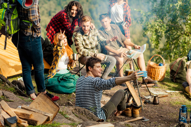 positive young company taking selfie outdoors - Fotó, kép