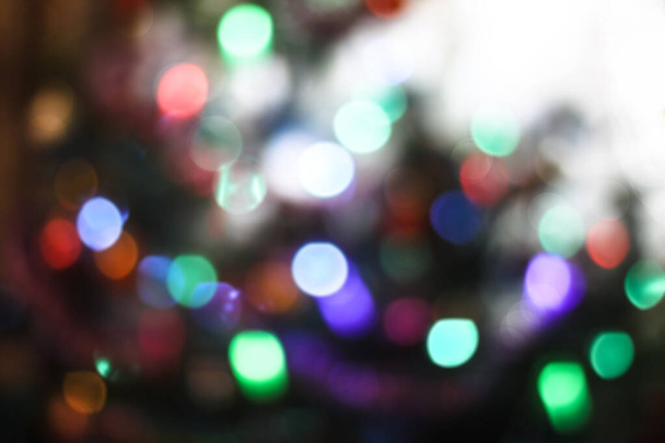 Beautiful Christmas background with garlands and bokeh. New year  multi-colored picture. Abstract photo image for design - Photo, Image