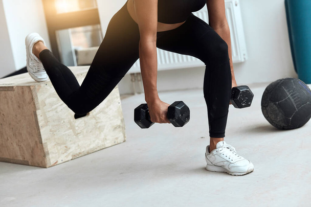 woman workout using kettlebells in gym - Фото, изображение