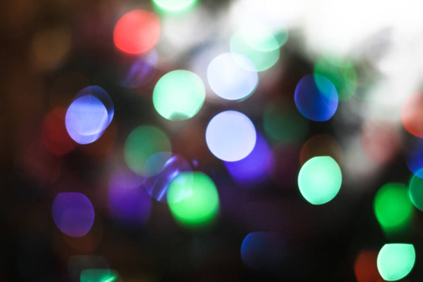 Beautiful Christmas background with garlands and bokeh. New year  multi-colored picture. Abstract photo image for design - 写真・画像