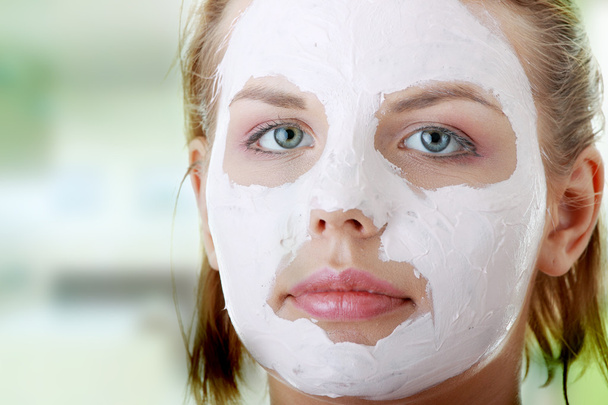 Young female face with clay mask - Photo, Image