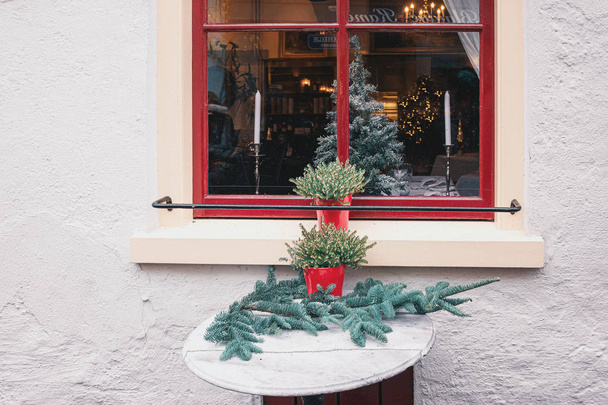 Decorated table in front of the window for Christmas - Photo, Image