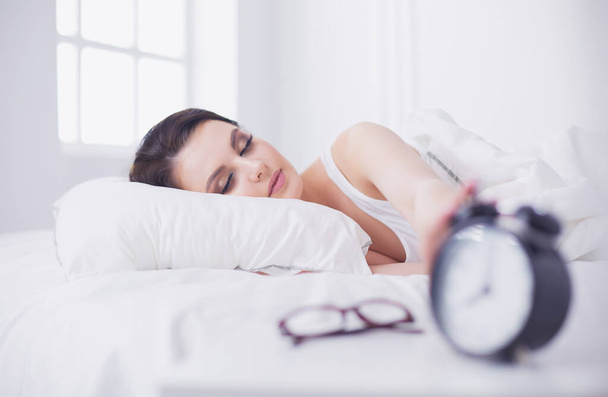 Young beautiful woman lying in bed. - Foto, Imagen