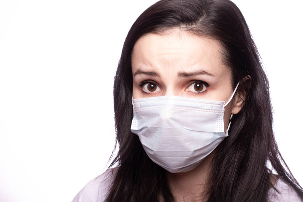 young woman in medical mask on her face - Foto, imagen