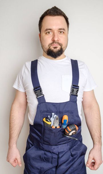 Construction worker with tools in his pocket - Фото, зображення