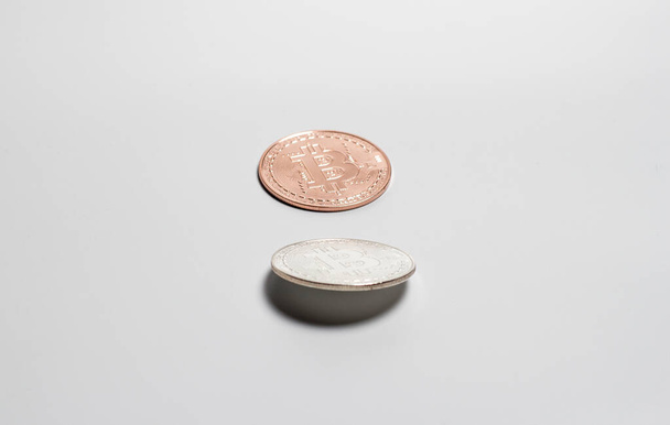 Bitcoin coin aka cryptocurrency on a white background - Φωτογραφία, εικόνα