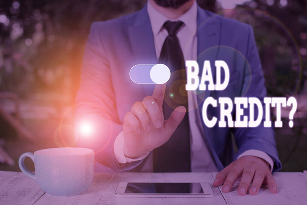 Conceptual hand writing showing Bad Creditquestion. Business photo text inabilityof a demonstrating to repay a debt on time and in full Male wear formal work suit presenting presentation smart device. - Photo, Image