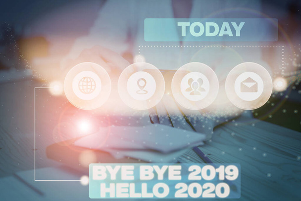 Word writing text bye bye 2019 hallo 2020. business concept for goodbye to last year and welcome another good one picture photo system network scheme modern technology smart device. - Foto, Bild