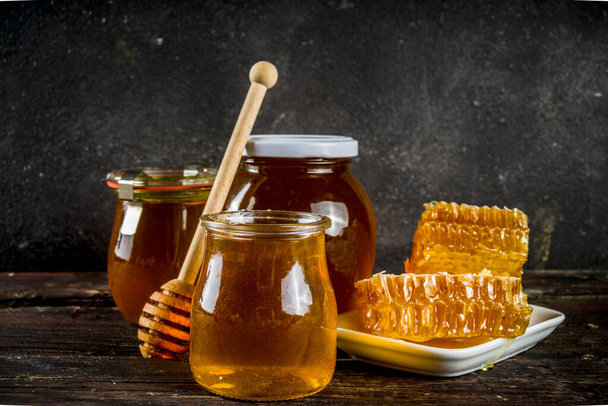 Organic farm honey in jars with honeycombs - Fotografie, Obrázek