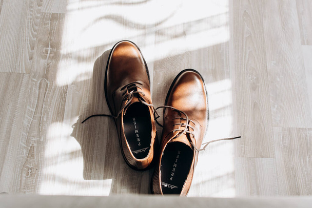 A man wears shoes. Going to work. He ties his shoelaces. - Fotó, kép
