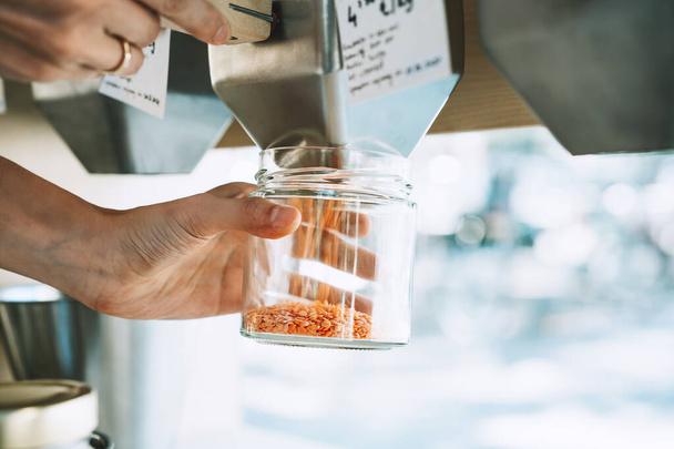 Zero waste shop. Shopping in sustainable plastic free grocery store - 写真・画像