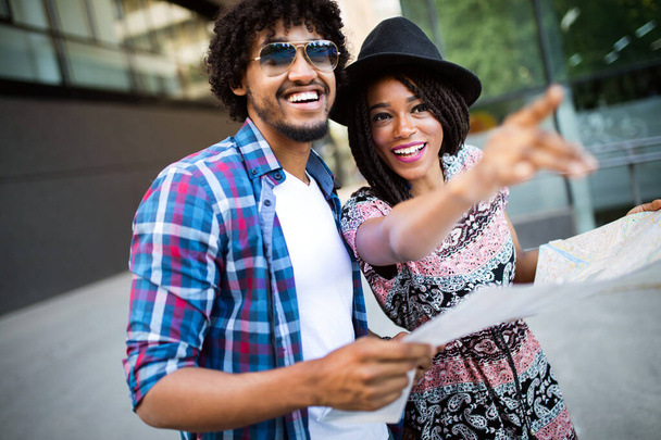 Young beautiful funny couple in love having fun outdoor on the street in summer - Fotoğraf, Görsel