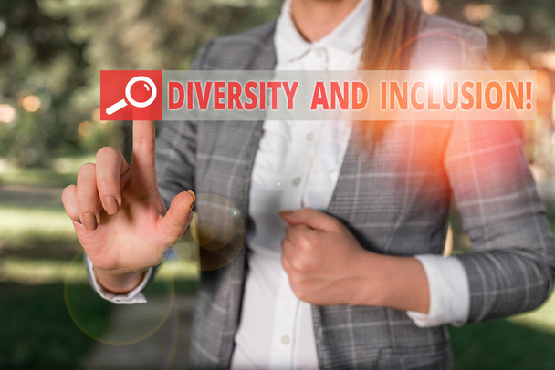 Handwriting text Diversity And Inclusion. Concept meaning range huanalysis difference includes race ethnicity gender Business woman in the nature pointing with the finger into empty space. - Photo, Image