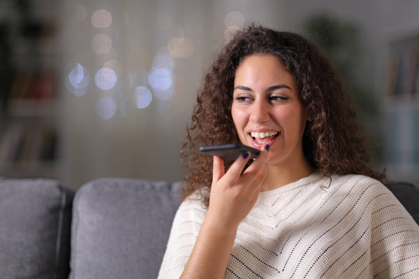 Happy woman using voice recognition on mobile phone - Fotografie, Obrázek