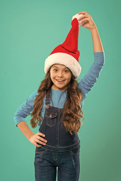 New year party. Santa claus kid. Present for Xmas. Childhood. Happy winter holidays. Small girl. Christmas shopping. Little girl child in santa hat. Christmas is coming. Beat the Christmas rush - Foto, immagini