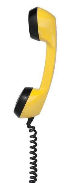 Hörer eines alten gelben Telefons. isoliert auf weiß - Foto, Bild
