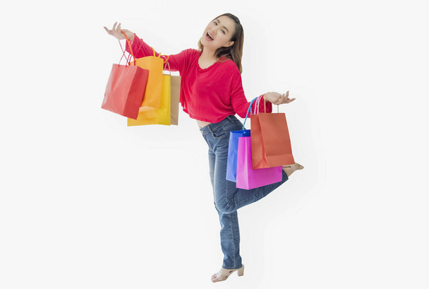 Portrait woman standing carry shopping bag in hand, fun and happ - Photo, Image