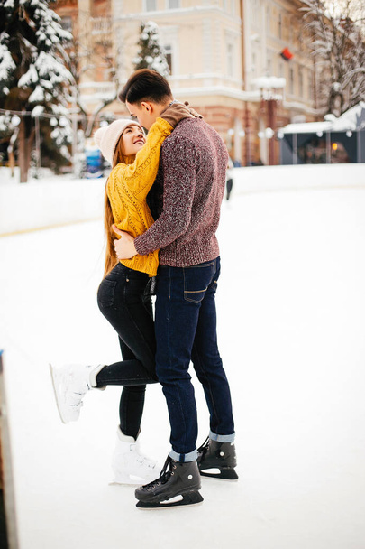 Cute couple in a ice arena - 写真・画像