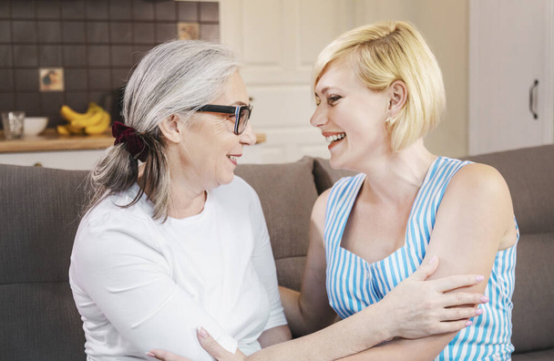 Smiling Elderly Mother and Her Young Adult Daughter - Photo, Image