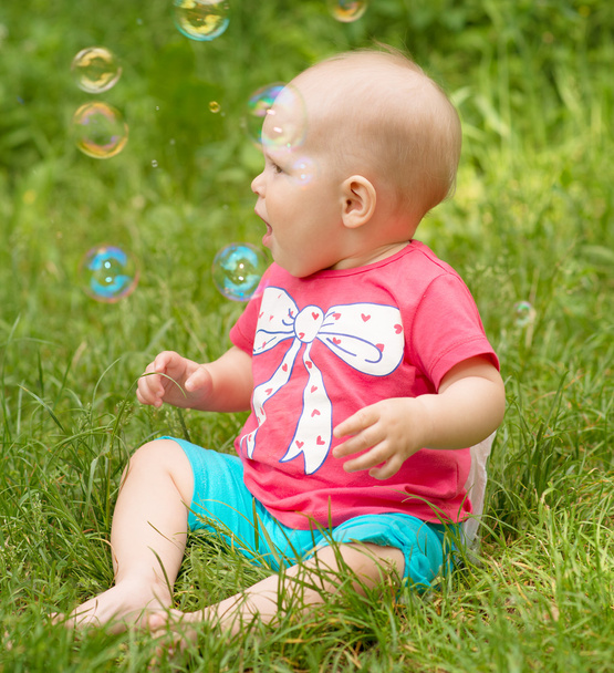 Baby with soap bubble - Fotó, kép