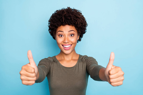 Close up photo of funny funky excited afro american girl show thumb up recommend promotion wear good look outfit isolated over blue color background - Φωτογραφία, εικόνα