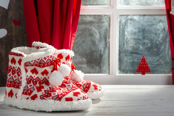 Merry Christmas concept greeting postcard with slipper shoes - Foto, Bild