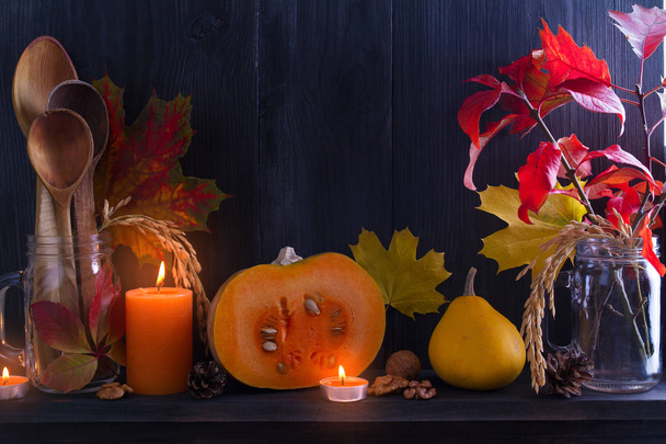 Autumn leaves, pumpkins, wooden spoons on black background. Thanksgiving autumn concept. Cozy autumn season food menu concept. Copy space - Foto, Imagen