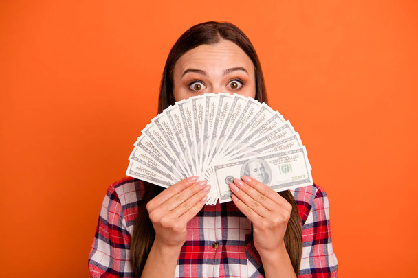 Millionaire can become everyone you must just do concept. Closeup photo of astonished pretty smart clever girl showing pile on money in her hands isolated bright color background - Foto, Imagem