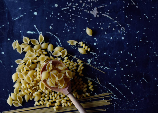 pasta of different shapes on a dark background - Foto, Imagem