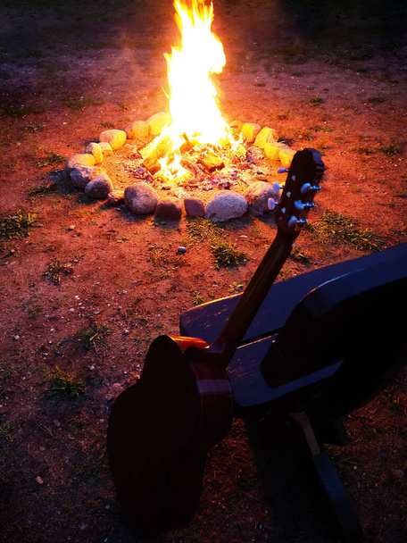 Bonfire in the night, outdoor camping in summer with guitar - Фото, зображення