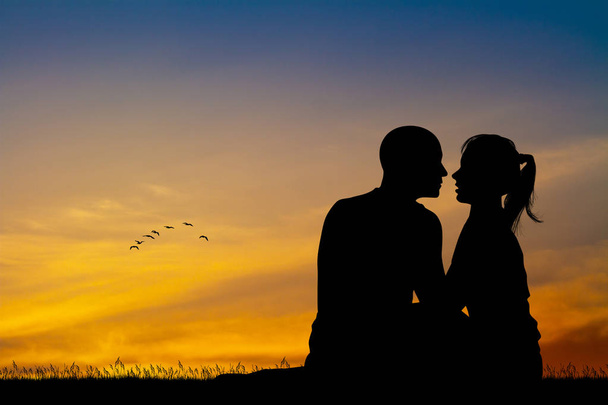 illustration of couple kissing at sunset - Foto, afbeelding