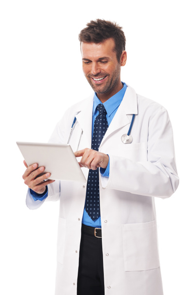 Doctor working on digital tablet - Фото, изображение