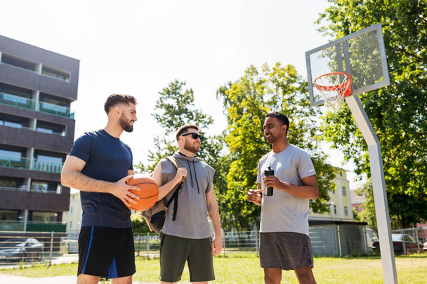 group of male friends going to play basketball - Fotografie, Obrázek