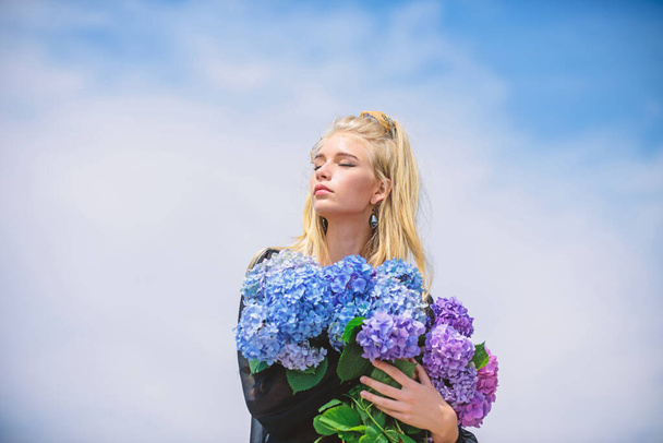 Fashion and beauty industry. Girl tender fashion model hold hydrangea flowers bouquet. Makeup and fashion style. Fashion trend spring. Meet spring with new perfume fragrance. Flowers tender fragrance - Foto, Imagen