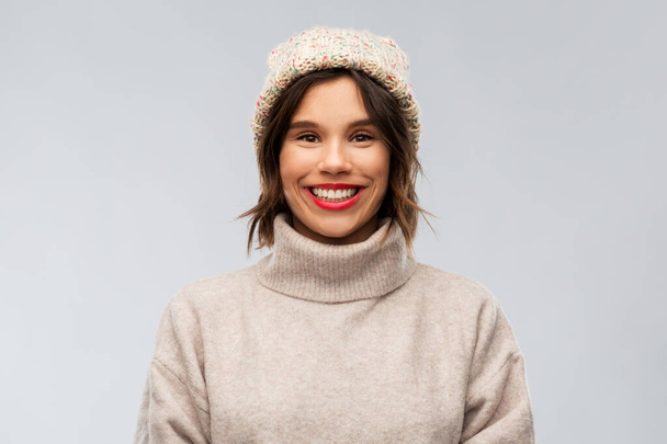 young woman in knitted winter hat and sweater - Foto, imagen