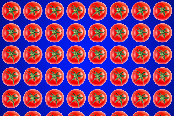 Vegetable pattern of red tomatoes on blue background.  - Φωτογραφία, εικόνα