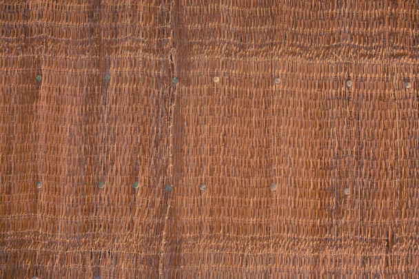 Straw woven fabric with uneven structure, textured background - Photo, Image