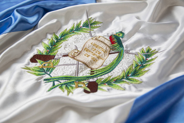 Close up of Guatemala flag - detail of Guatemalan national shield - Photo, Image