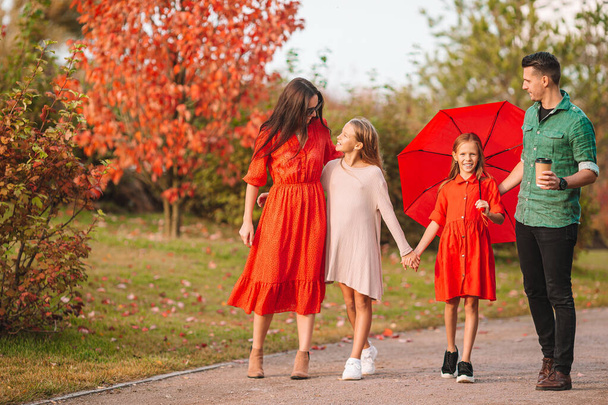 Portrait of happy family of four in autumn - Foto, Imagem