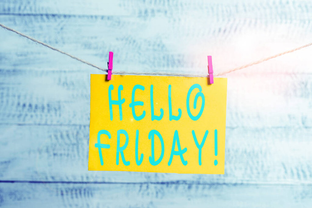 Conceptual hand writing showing Hello Friday. Business photo text you say this for wishing and hoping another good lovely week Clothespin rectangle shaped paper reminder white wood desk. - Фото, изображение